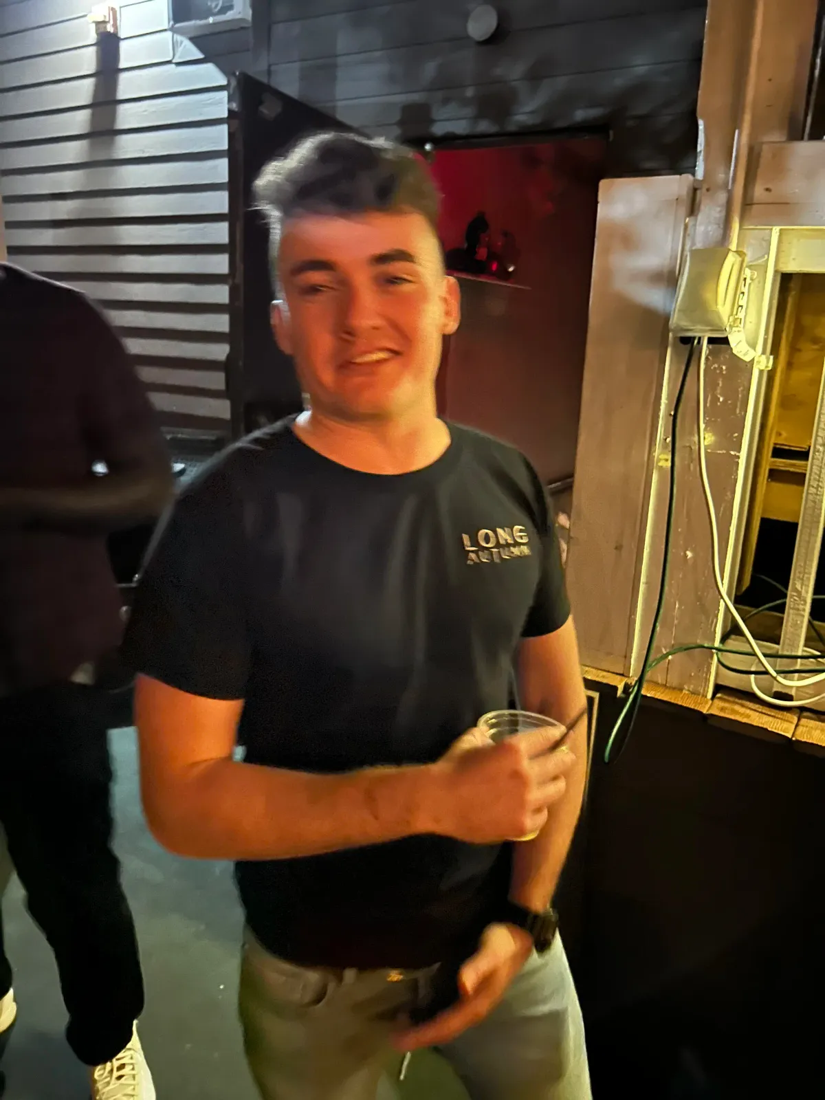 Fan wearing Long Autumn tee