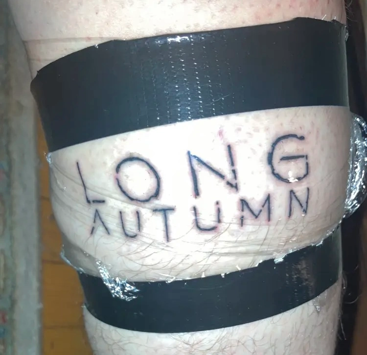 Fan wearing Long Autumn tee